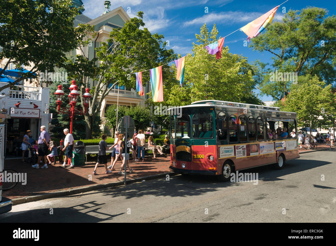 Street scene of Provincetown Cape Cod with tour trolley bus. Stock Photo