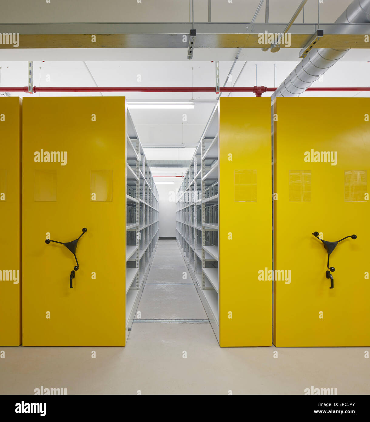 Sliding archive and record repository in yellow. Herefordshire Archives, Hereford, United Kingdom. Architect: Architype Limited, Stock Photo