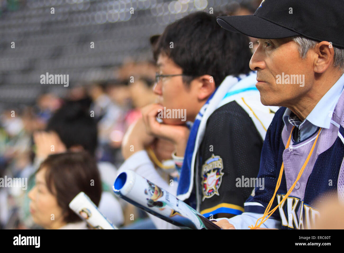 Fans at the Sapporo Dome in Sapporo, Hokkaido gather to watch a game of the Nippon Ham Fighters baseball team Stock Photo