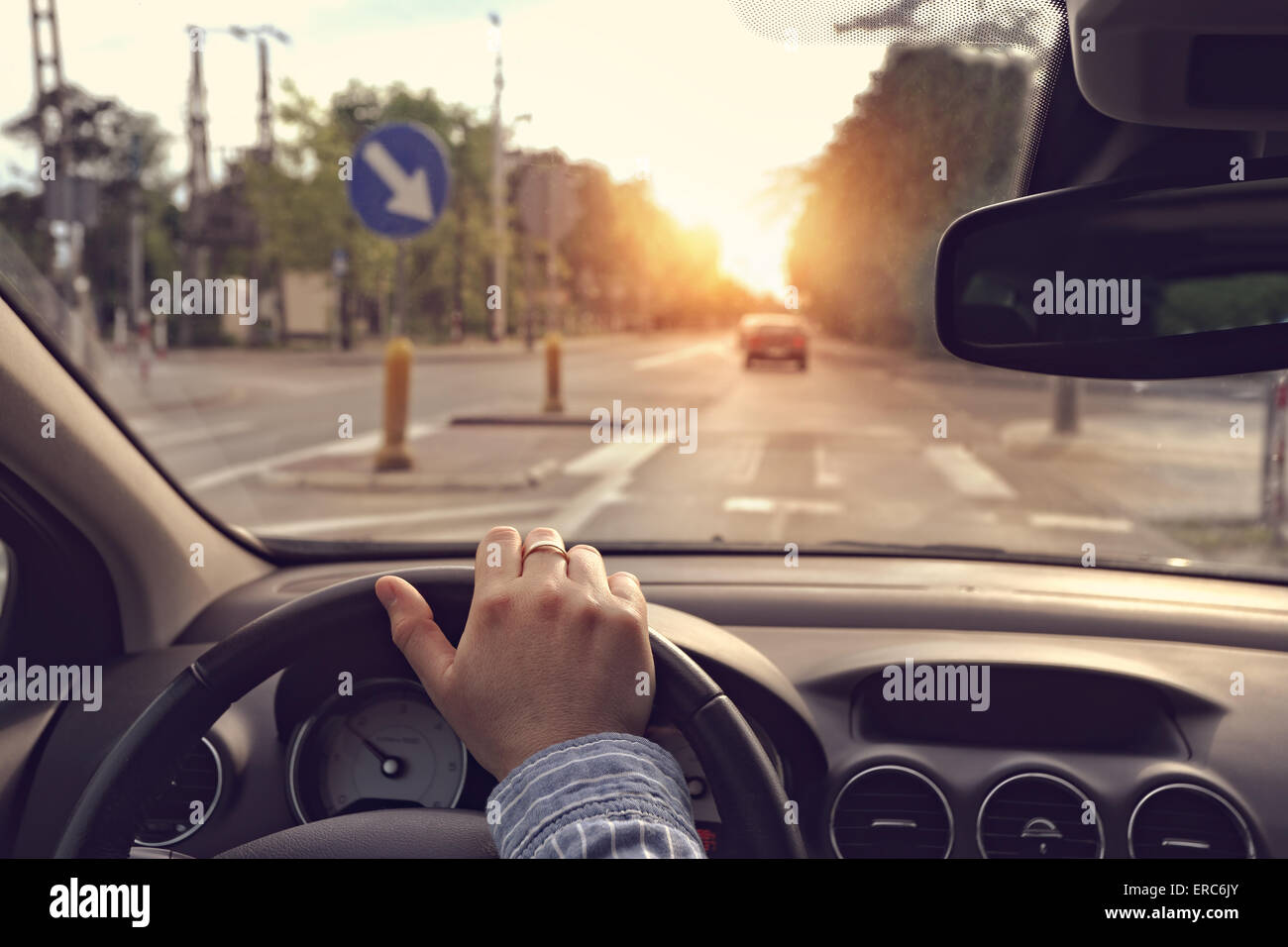 The driver with hand on the steering wheel Stock Photo - Alamy