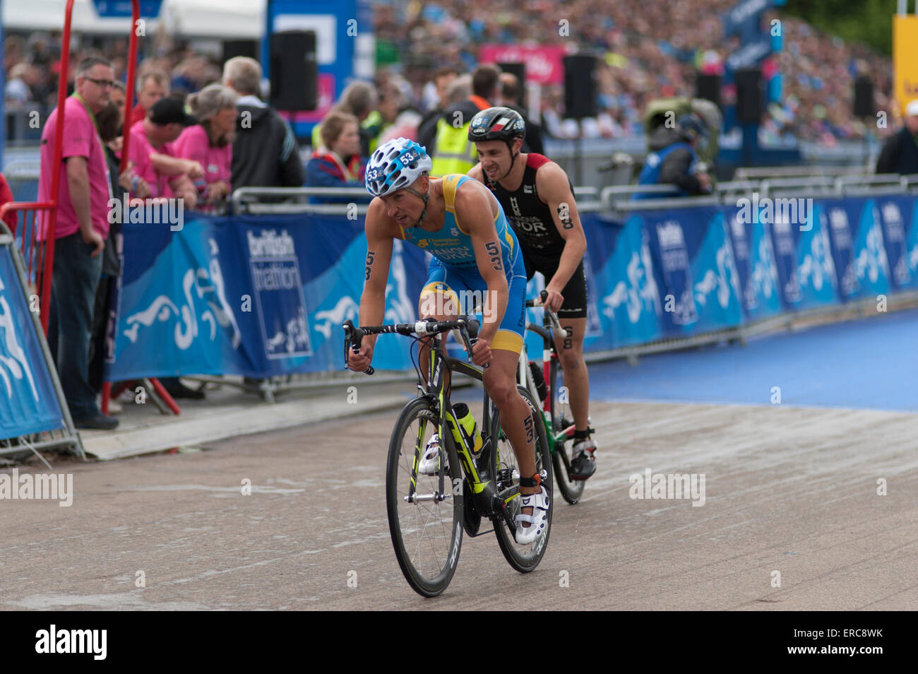 Chasing cyclists during the ITU London Triathlon in Hyde Park. Stock Photo