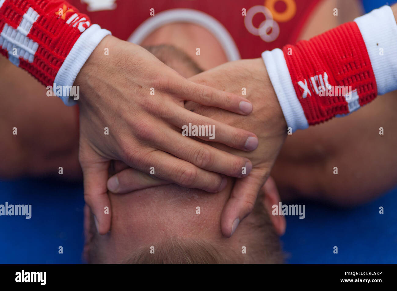 An athlete recovers after the Elite Mens Race at the ITU London Triathlon. Stock Photo