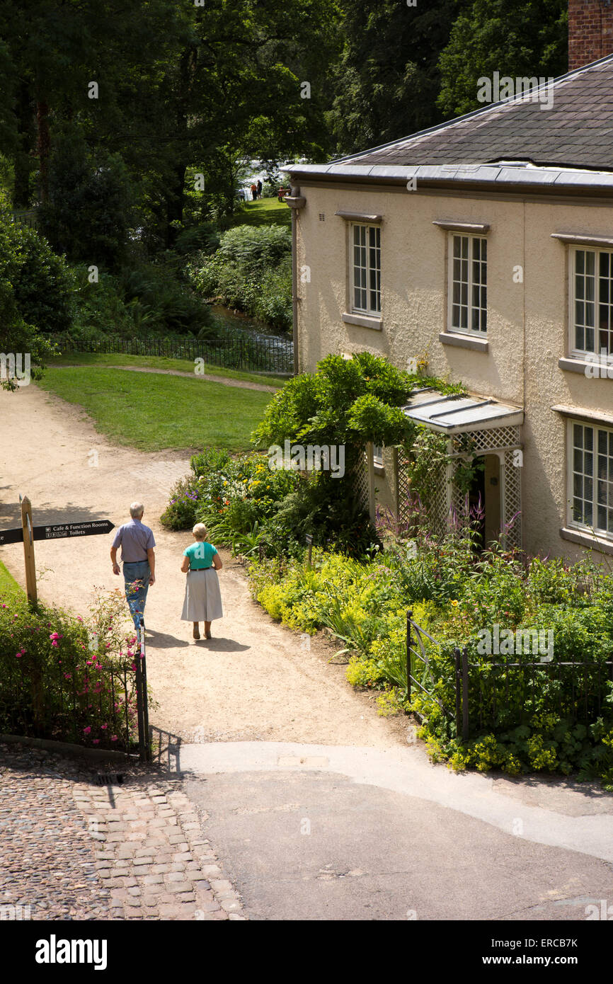 UK, England, Cheshire, Styal, Quarry Bank Mill, visitors walking through manager’s house garden Stock Photo