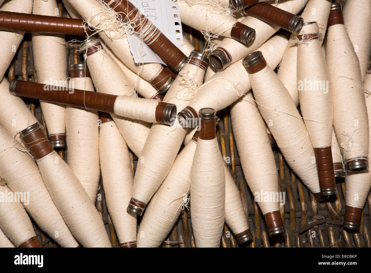 UK, England, Cheshire, Styal, Quarry Bank Mill, spindles of spun cotton Stock Photo