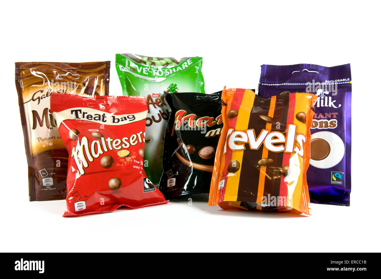 Mix of chocolate sharing bags on white background including maltesers, revels, mars mix, aero peppermint, minstrels and buttons Stock Photo