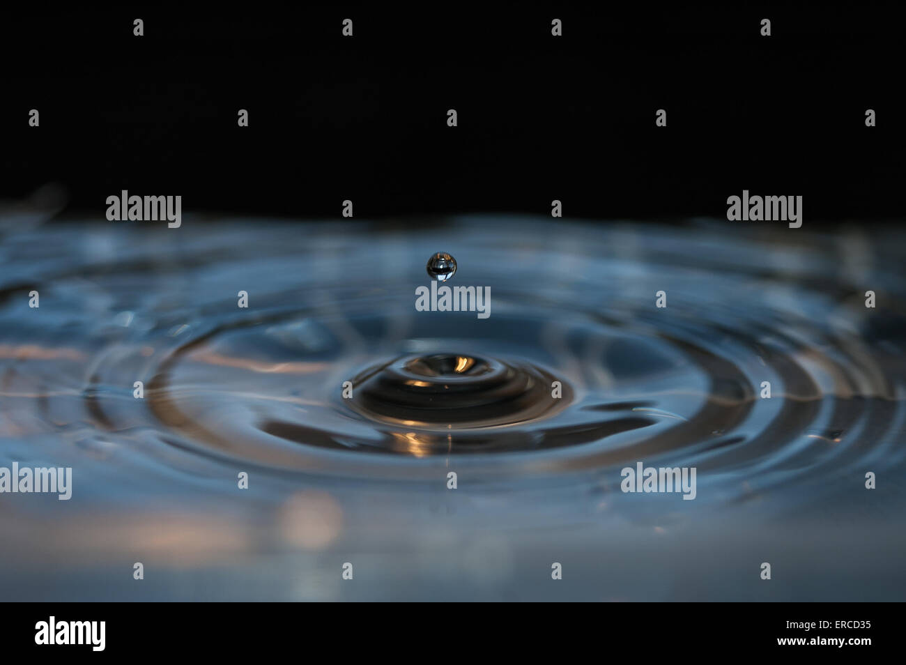 a drop on a surface Stock Photo - Alamy