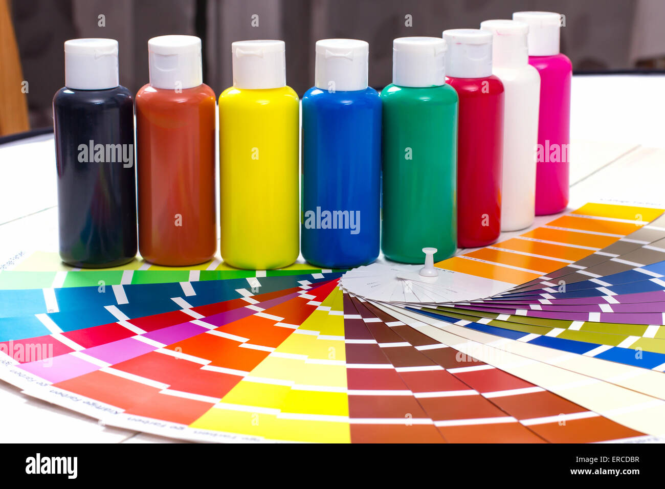 color palette, tubes of paint on white wooden background, close up Stock Photo