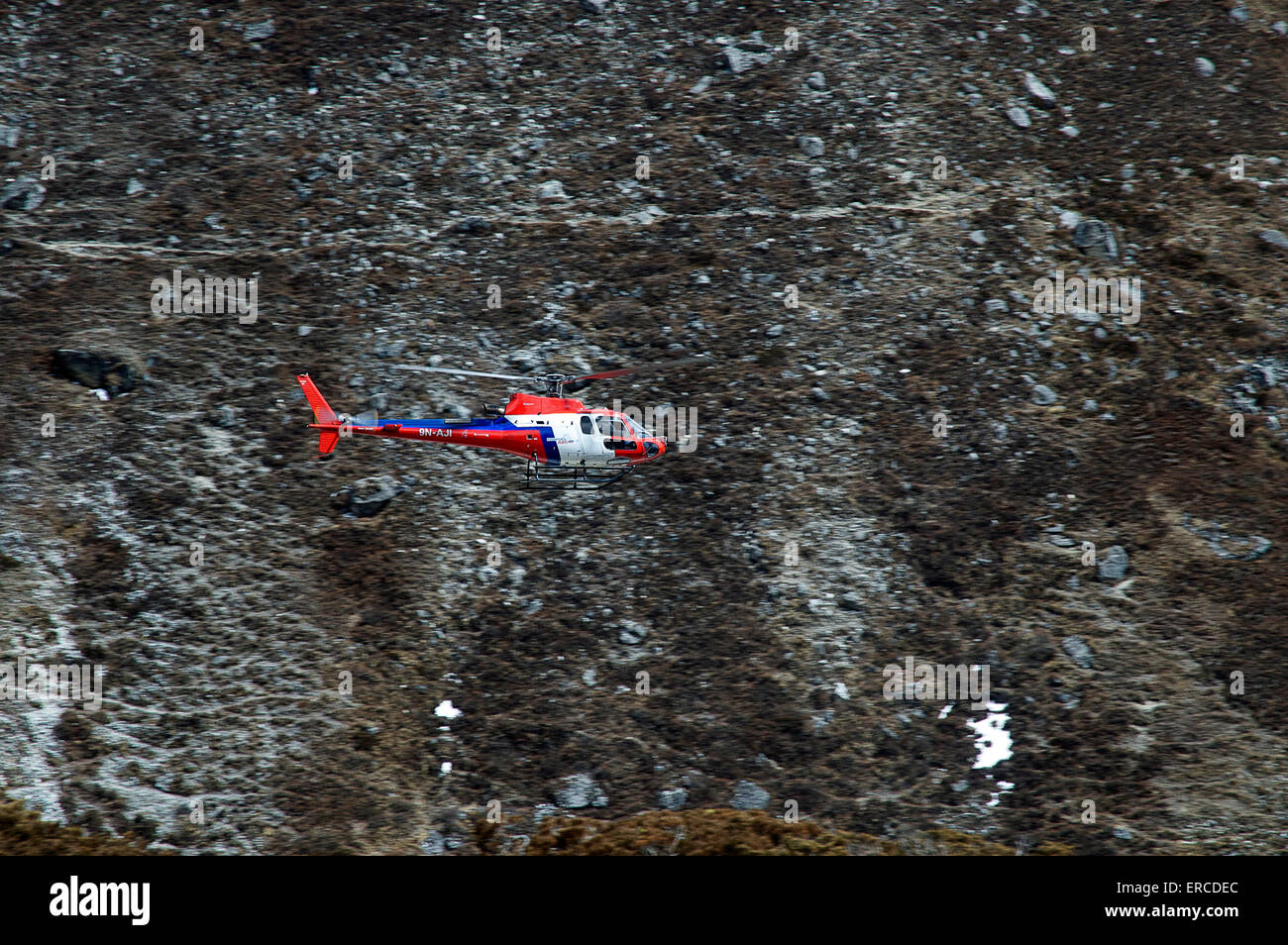 A Eurocopter AS350 B3 Squirrel helicopter belonging to Fishtail Air flying in the Khumbu, Nepal. Stock Photo