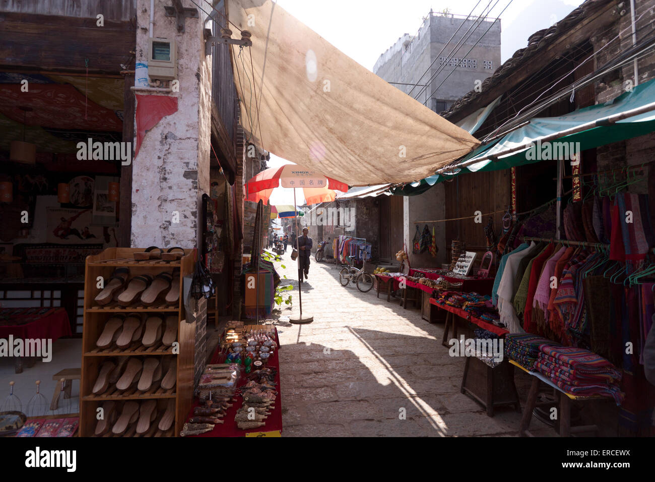 Narrow street with stalls in China Stock Photo