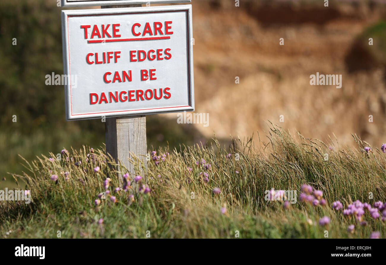Sign at Freshwater Cliffs and Freshwater Bay warning cliff edges can be dangerous Stock Photo