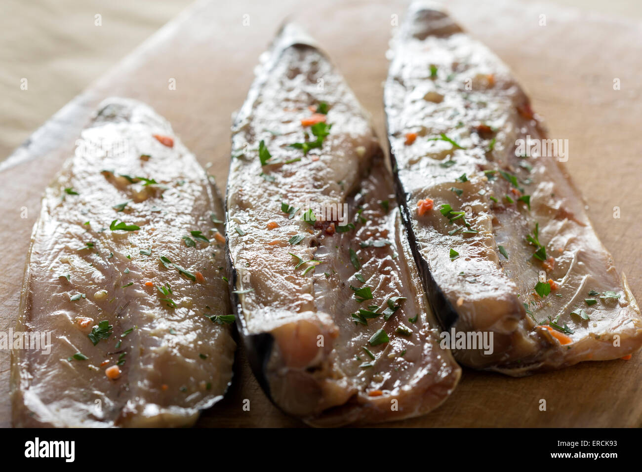 Raw mackerel is prepared for cooking with vegetables Stock Photo