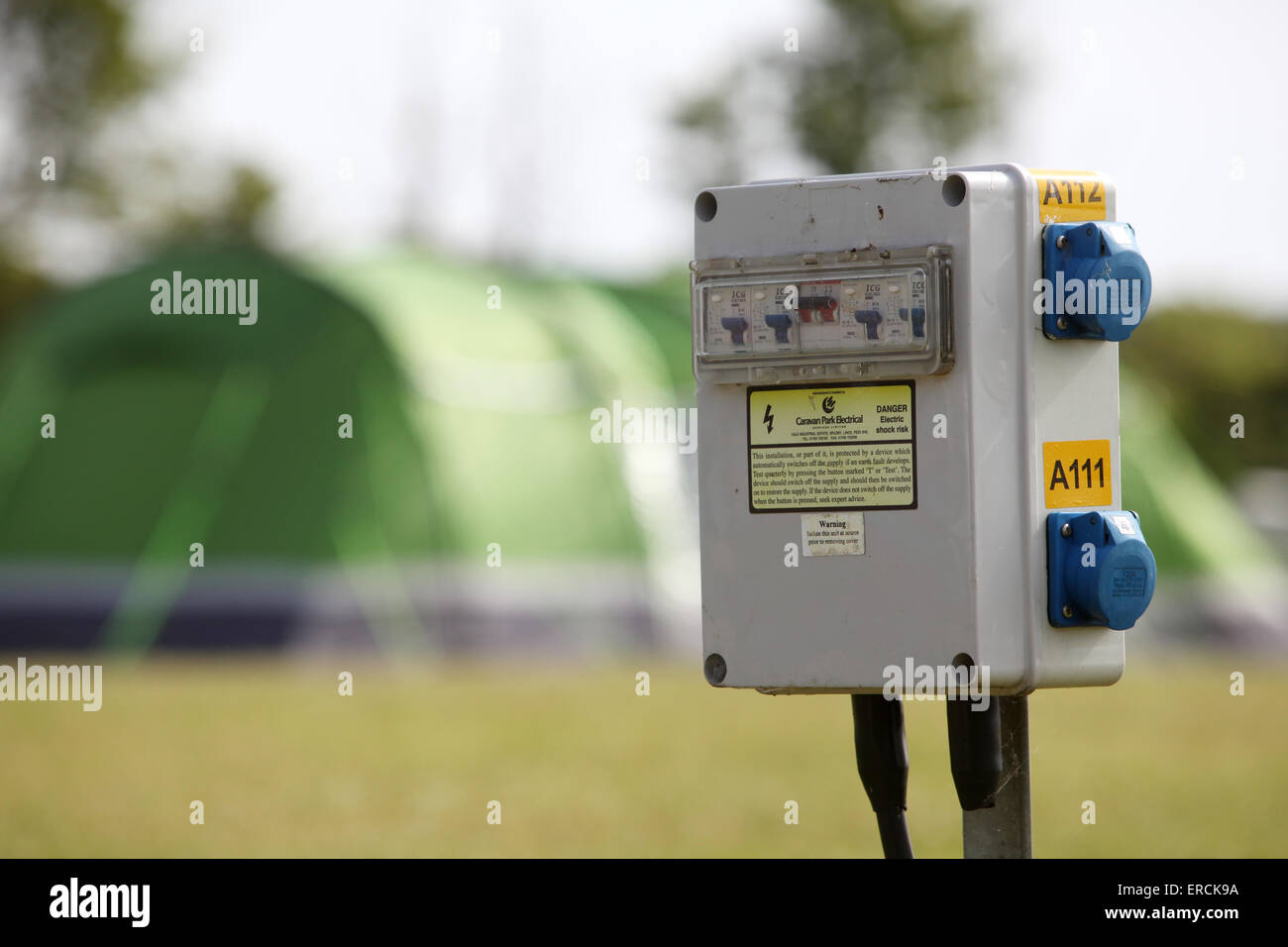 Electric hook up power point on a campsite in the UK used by caravans and tents Stock Photo