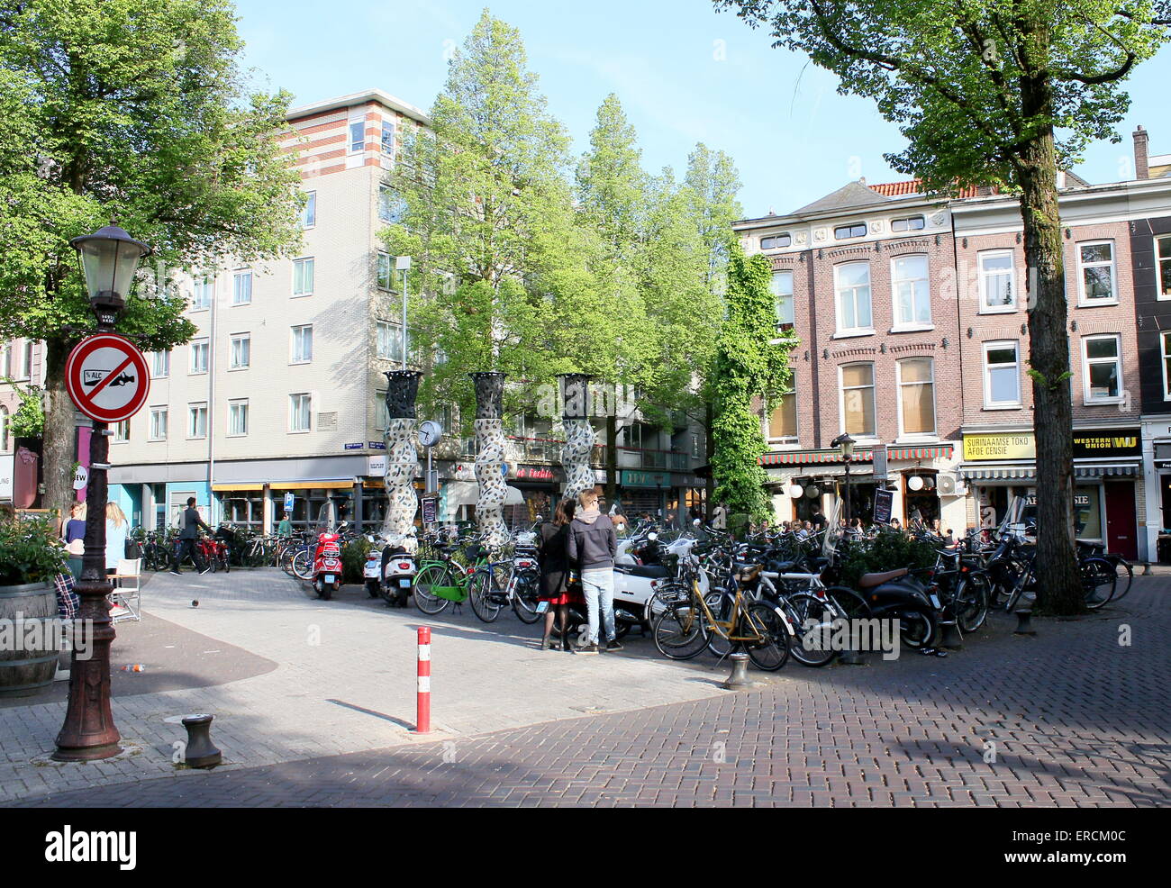 People  wining and dining on a summer evening at Gerard Douplein, de Pijp district, Amsterdam Stock Photo