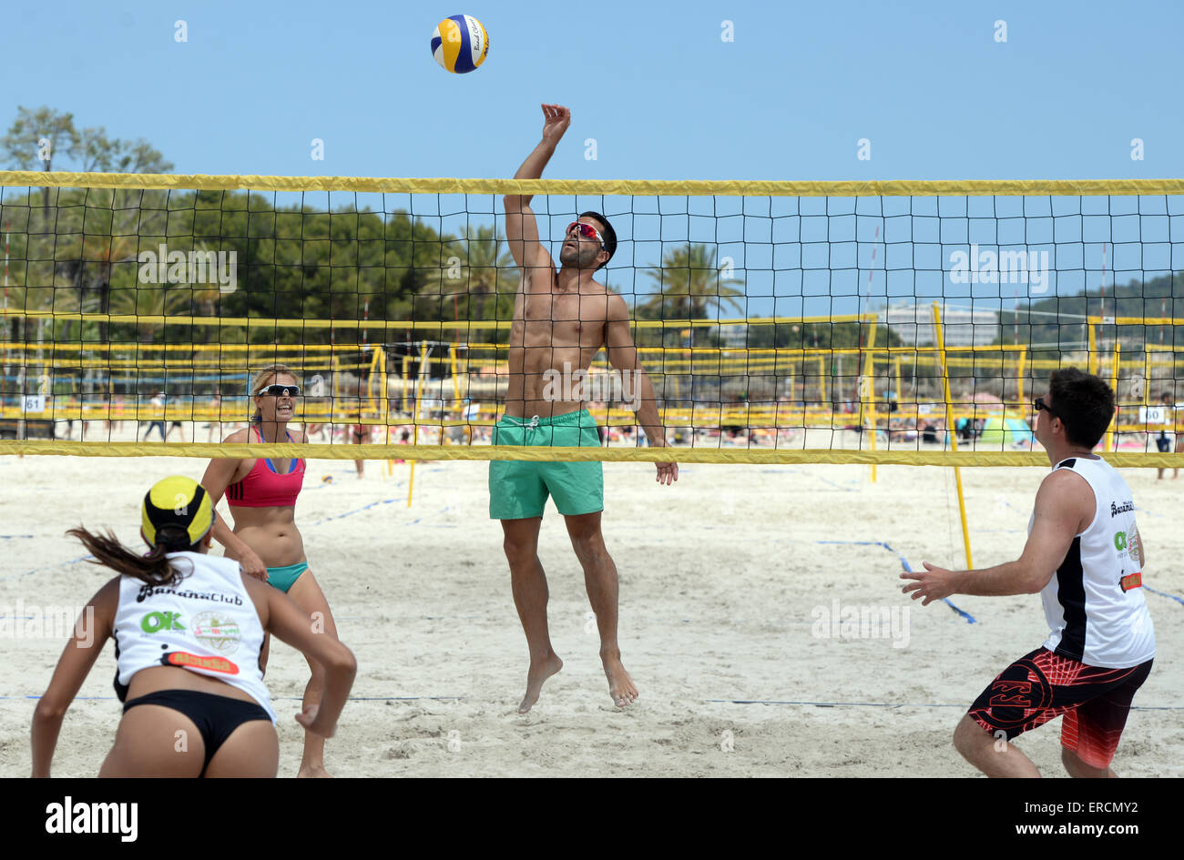Mixed beach volleyball tournament between boys and girls on the beach in  Alcudia, Mallorca Stock Photo - Alamy