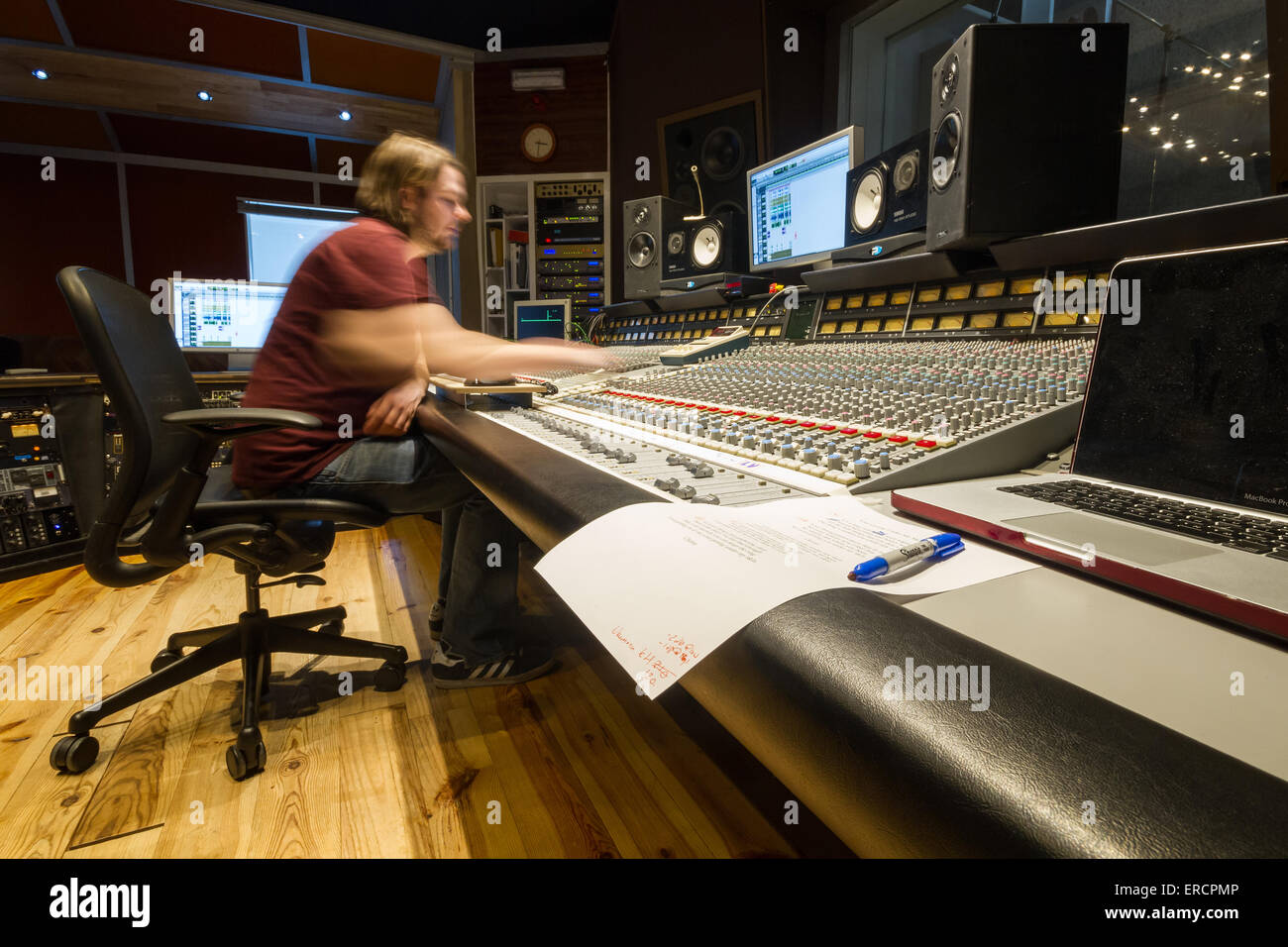 A recording engineer at work during a session at The Chairworks
