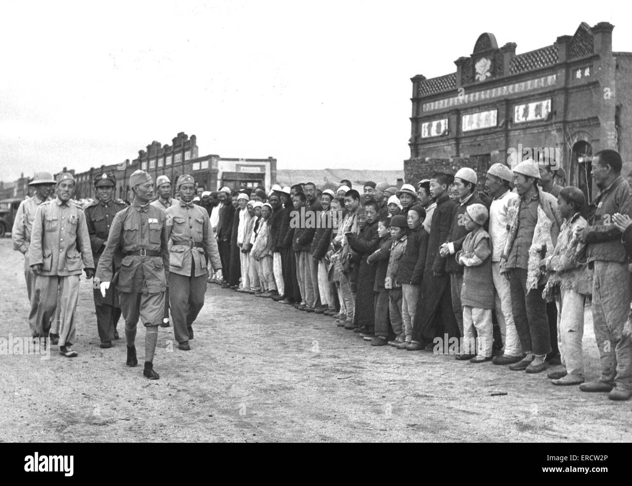 SUN LANG-FEN  Chinese Nationalist Army General reviews inhabitants of Chasper, Mongolia, NW of Beijing, about 1947 Stock Photo
