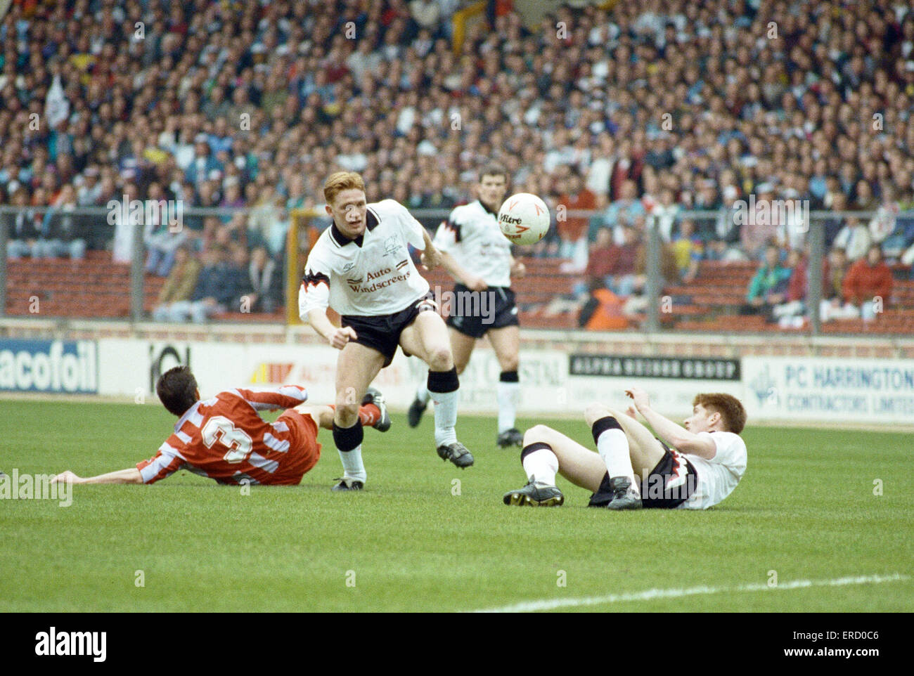 Anglo Italian Cup Final at Wembley Stadium. Derby County  1 v Cremonese 3. Tommy Johnson lies grounded and Shane Nicholson looks on as Mark Pembridge does battle in midfield. 27th March 1993. Stock Photo