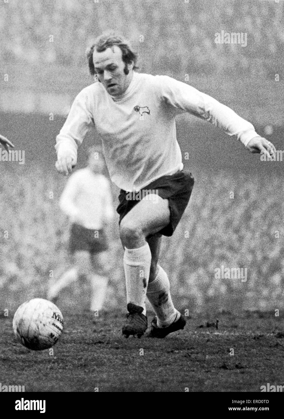 FA Cup Fifth Round match at the Baseball Ground. Derby County 2 v Arsenal 2. Derby's Archie Gemmill opn the ball.  22nd January 1972. Stock Photo