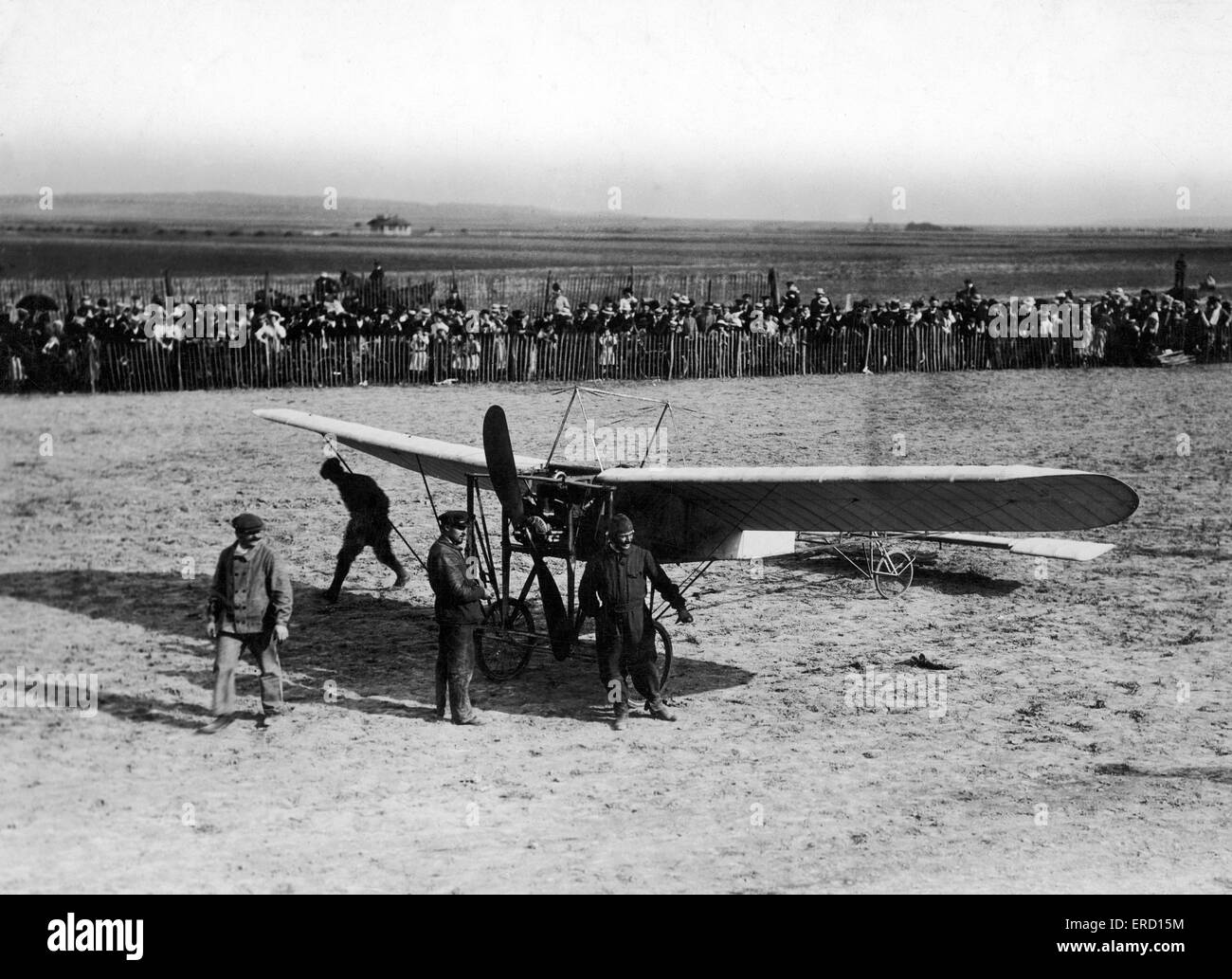 Avaitor Alfred Leblanc beside the Bleriot XI monoplane belonging to French aviator Louis Bleriot in which he made his historic crossing of the English Channel  on 25th July 1909, pictured on display at Rheims Aviation week. 24th August 1909. Stock Photo