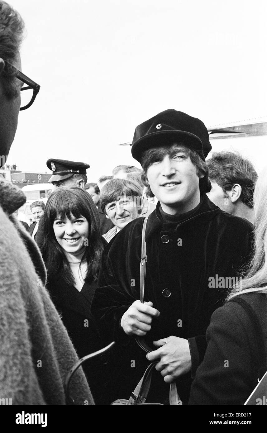The Beatles at London Heathrow Airport, flying out to Austria to film scenes for new film 'Help!', pictured morning of Saturday 13th March 1965. John Lennon and Maureen Starkey, wife of Ringo Starr. Stock Photo
