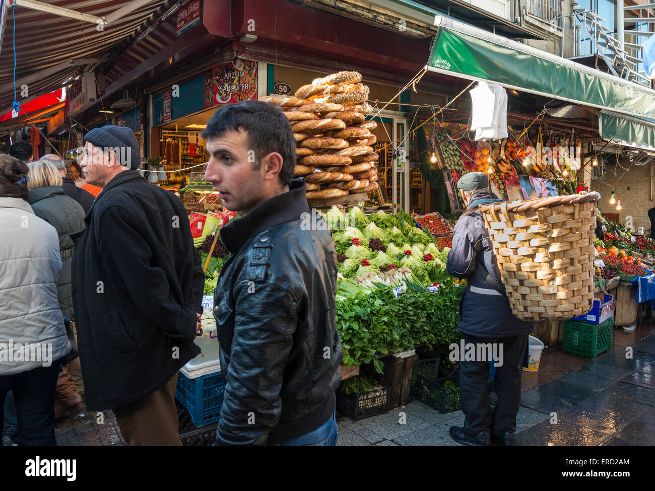 Simit bread vendor and porter in Kadikoy street market, Istanbul