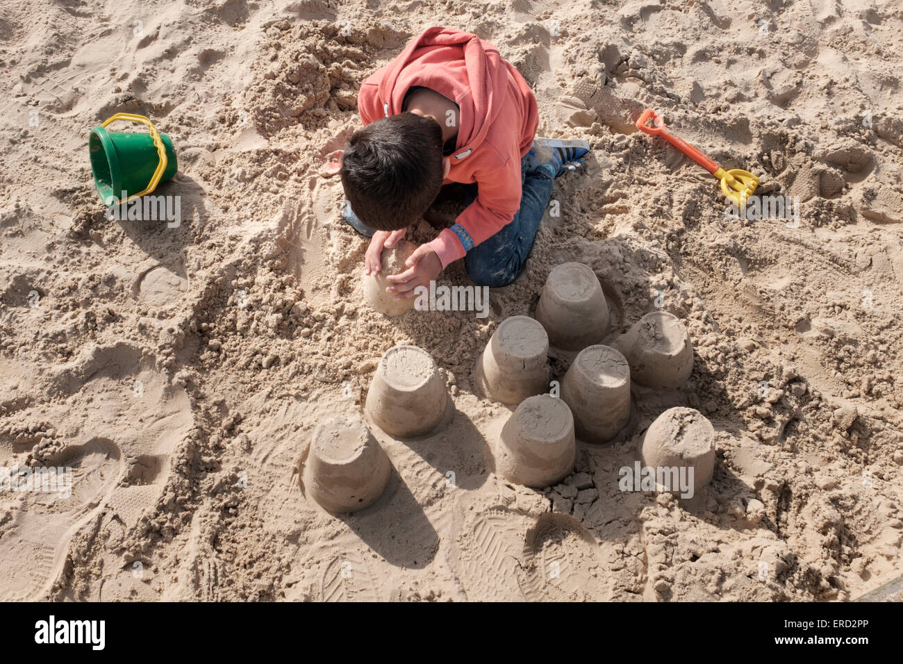 Child building a sand castle Stock Photo