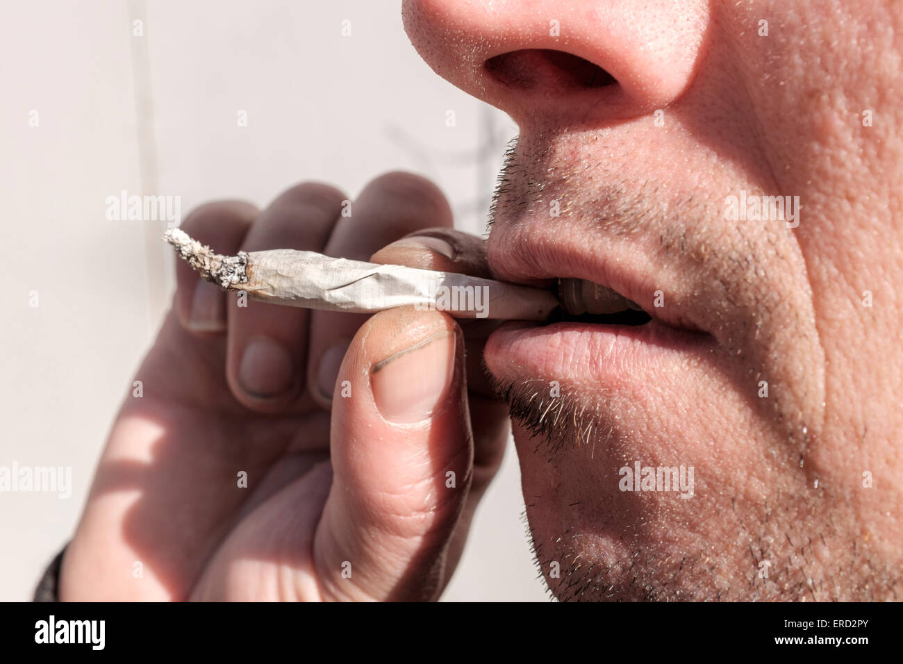 Man smoking a joint Stock Photo