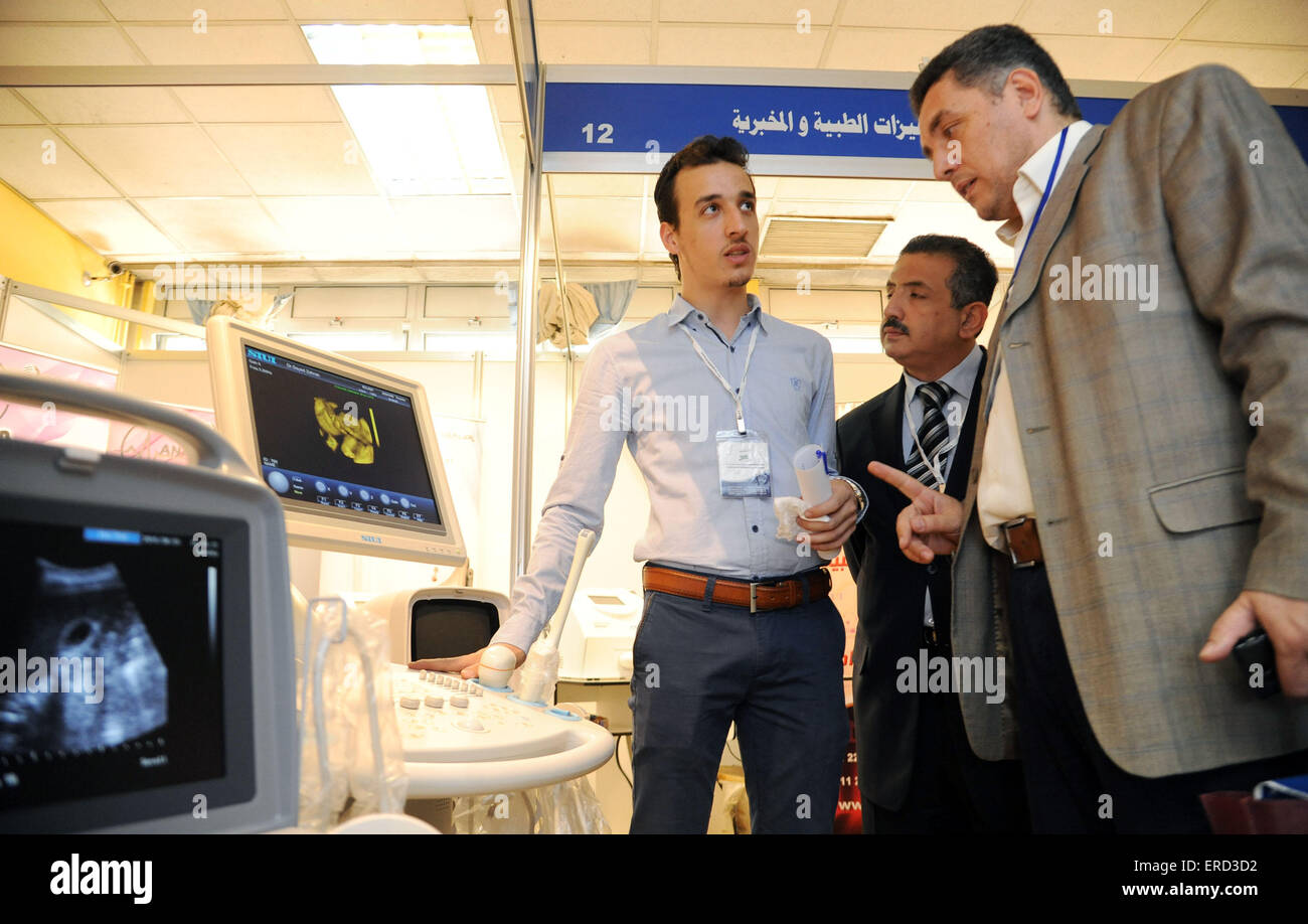 Damascus, Syria. 1st June, 2015. A business representative (L