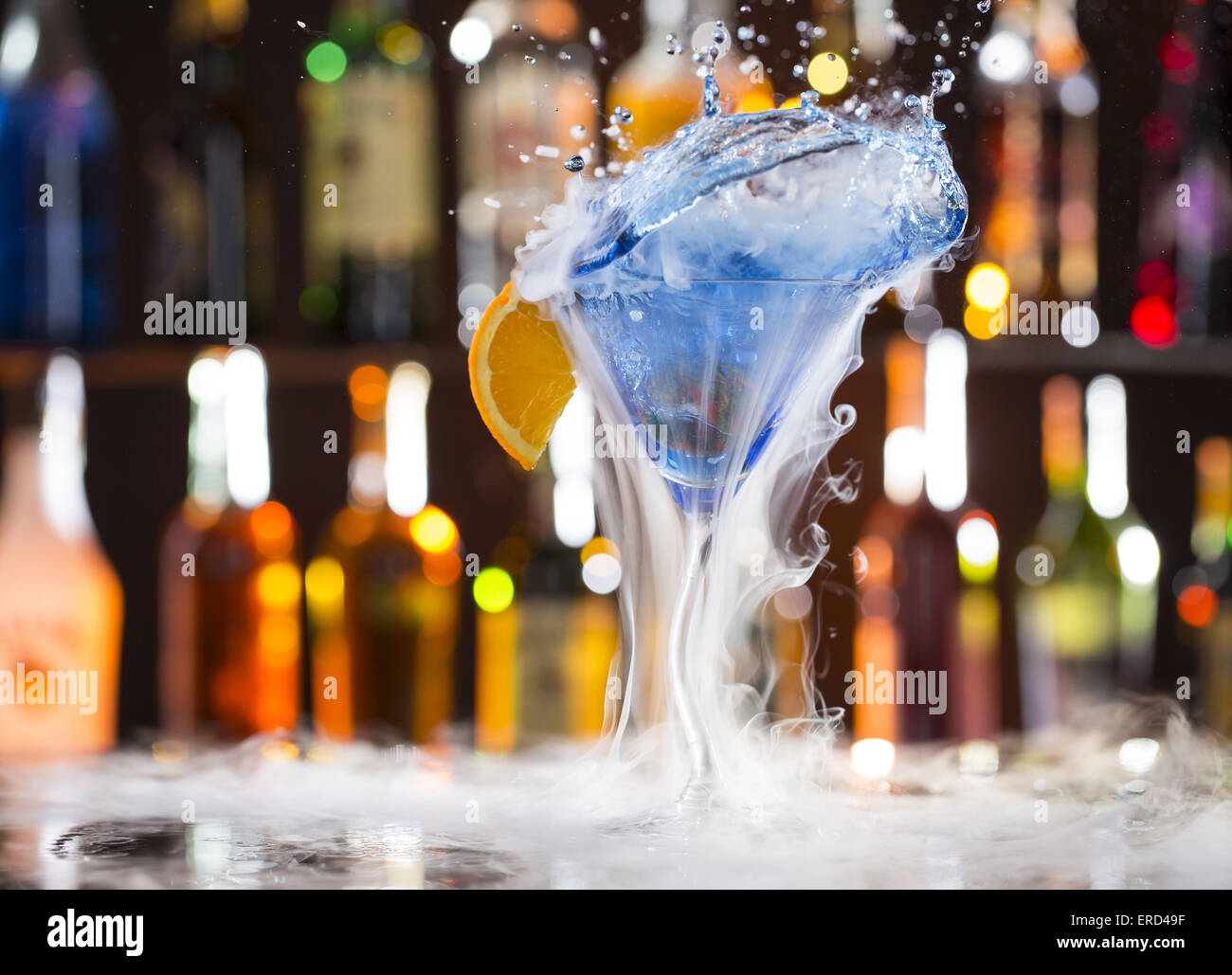 Cocktail with ice vapor on bar desk, close-up. Stock Photo