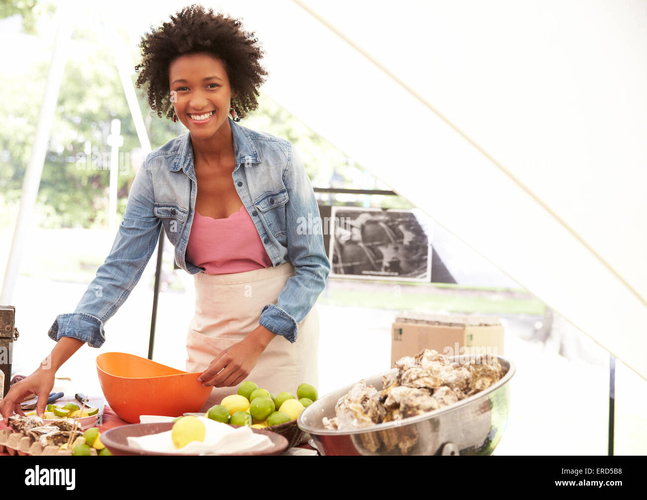 Woman Selling Fresh Oysters At Farmers Food Market Stock Photo