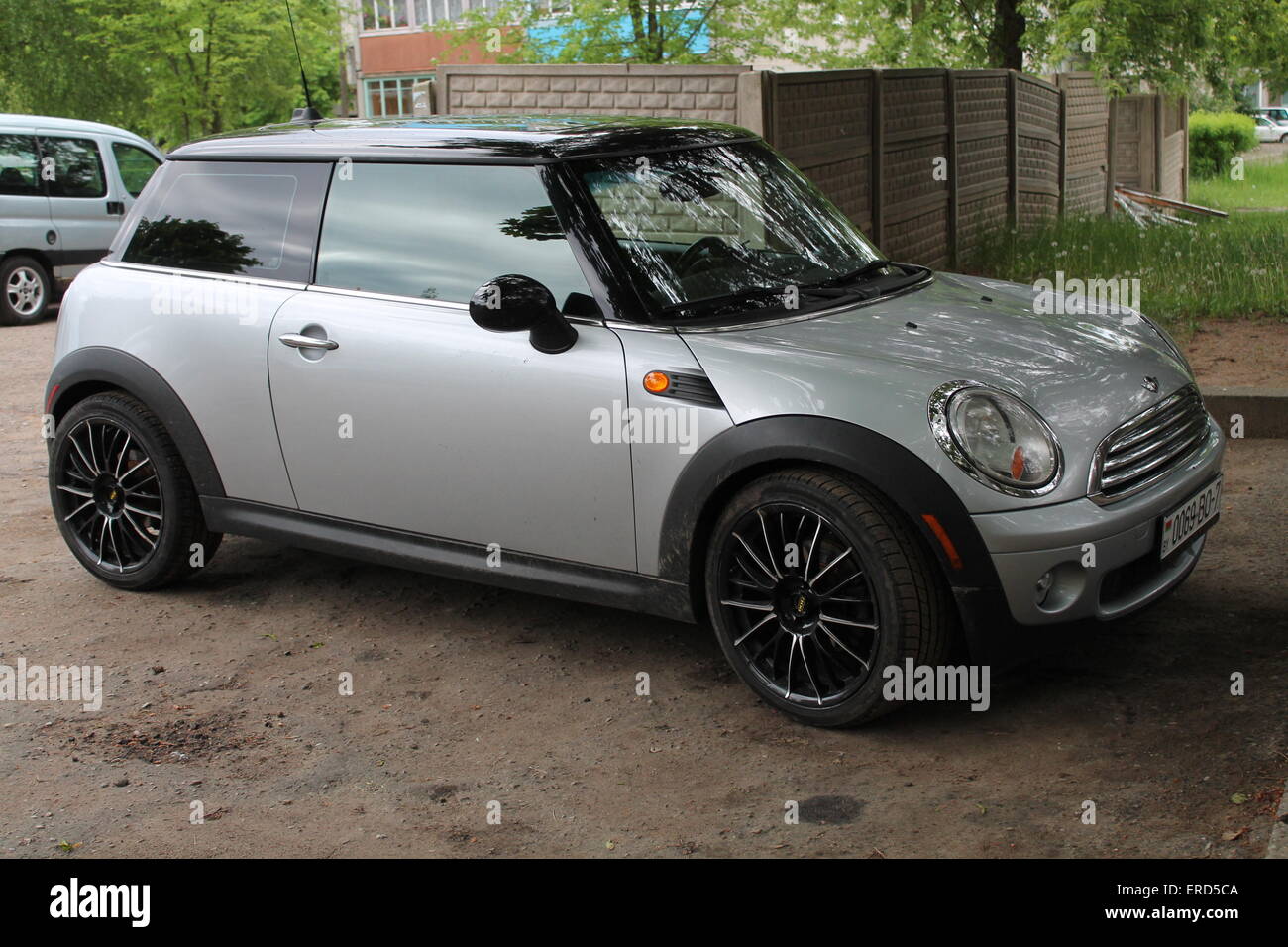 silver shine little dodge car parking on the street in shadow test drive for sell Stock Photo