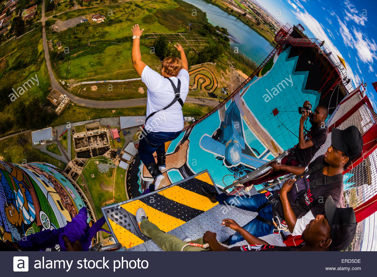 A woman going off the 100 meter (328 foot) bungee jump at Orlando Stock