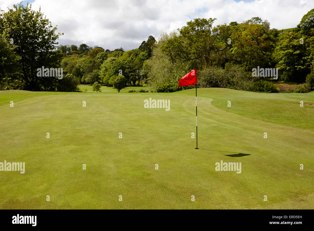 green pin and flag at Cushendall golf course County Antrim Northern Ireland UK Stock Photo