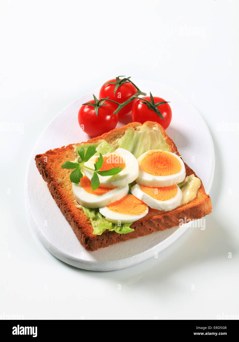 Open faced egg sandwich studio Stock Photo Alamy