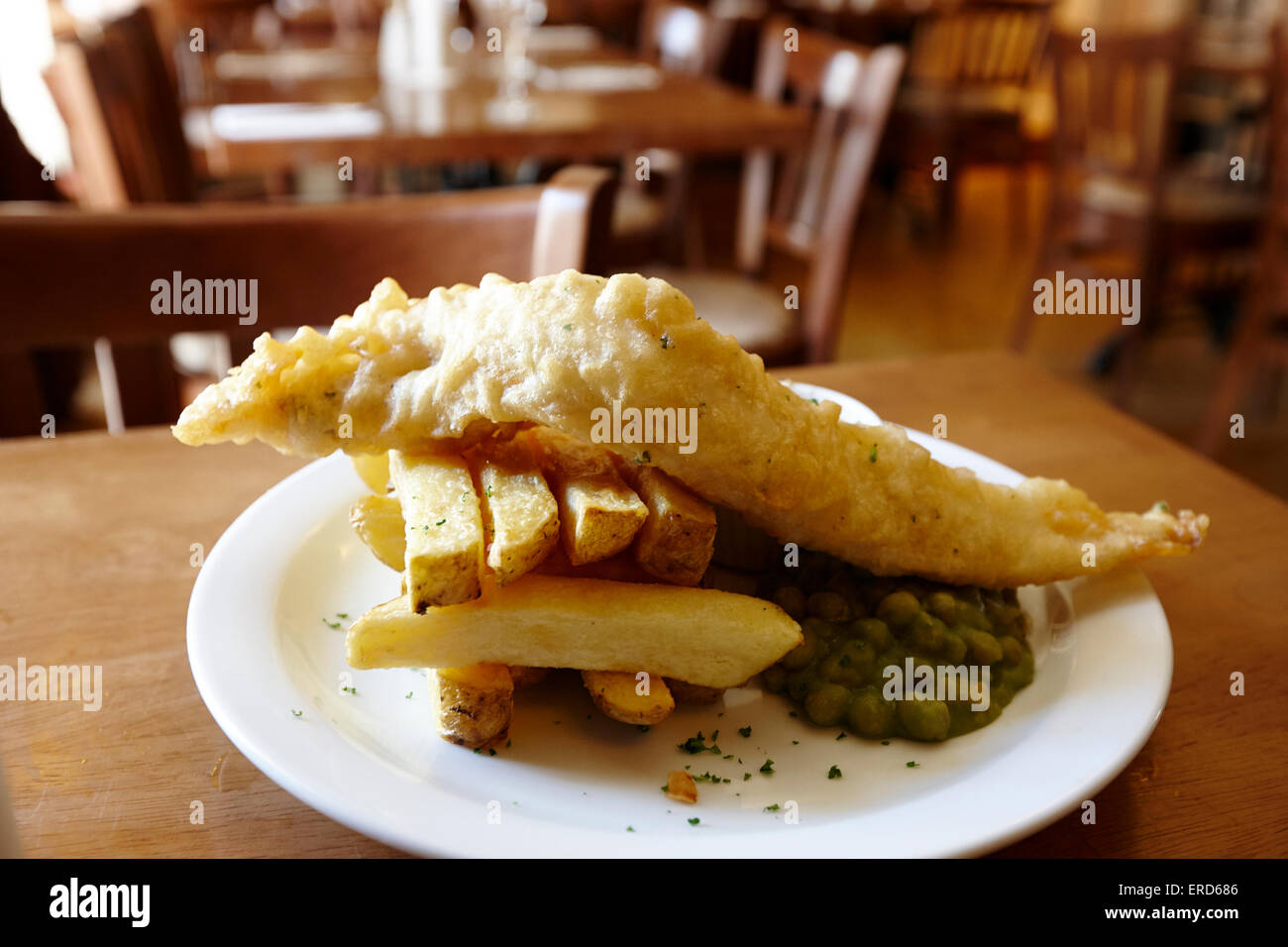 local produce fish and chips in restaurant in Cushendall County Antrim Northern Ireland UK Stock Photo