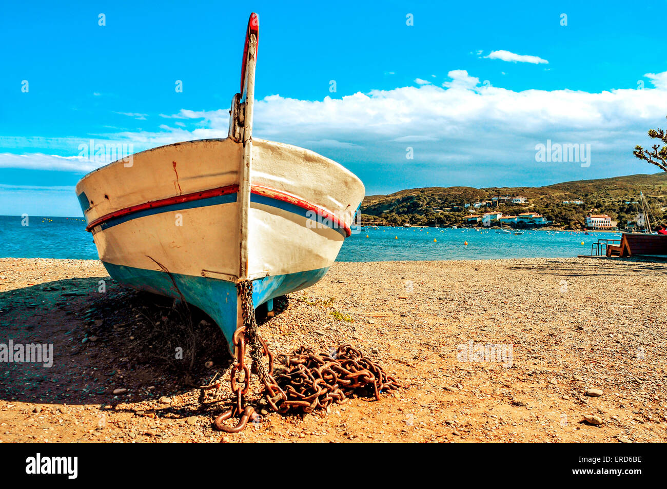 closeup of an old fishing boat stranded on a shingle beach in Cadaques ...