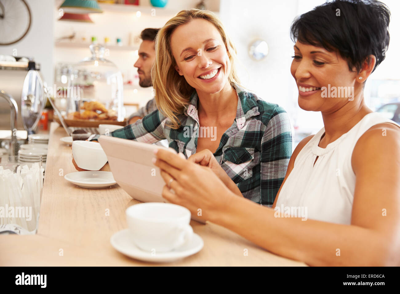 Two women at a meeting in a cafe Stock Photo - Alamy
