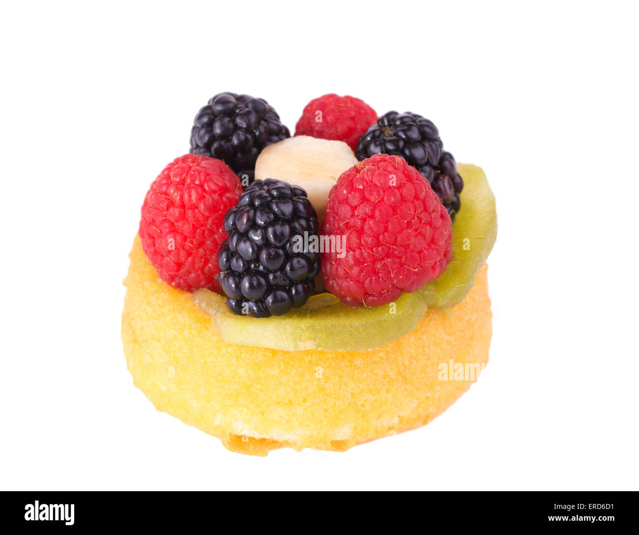 Raspberries, kiwi, banana and blackberries topping a dessert shell, on white Stock Photo
