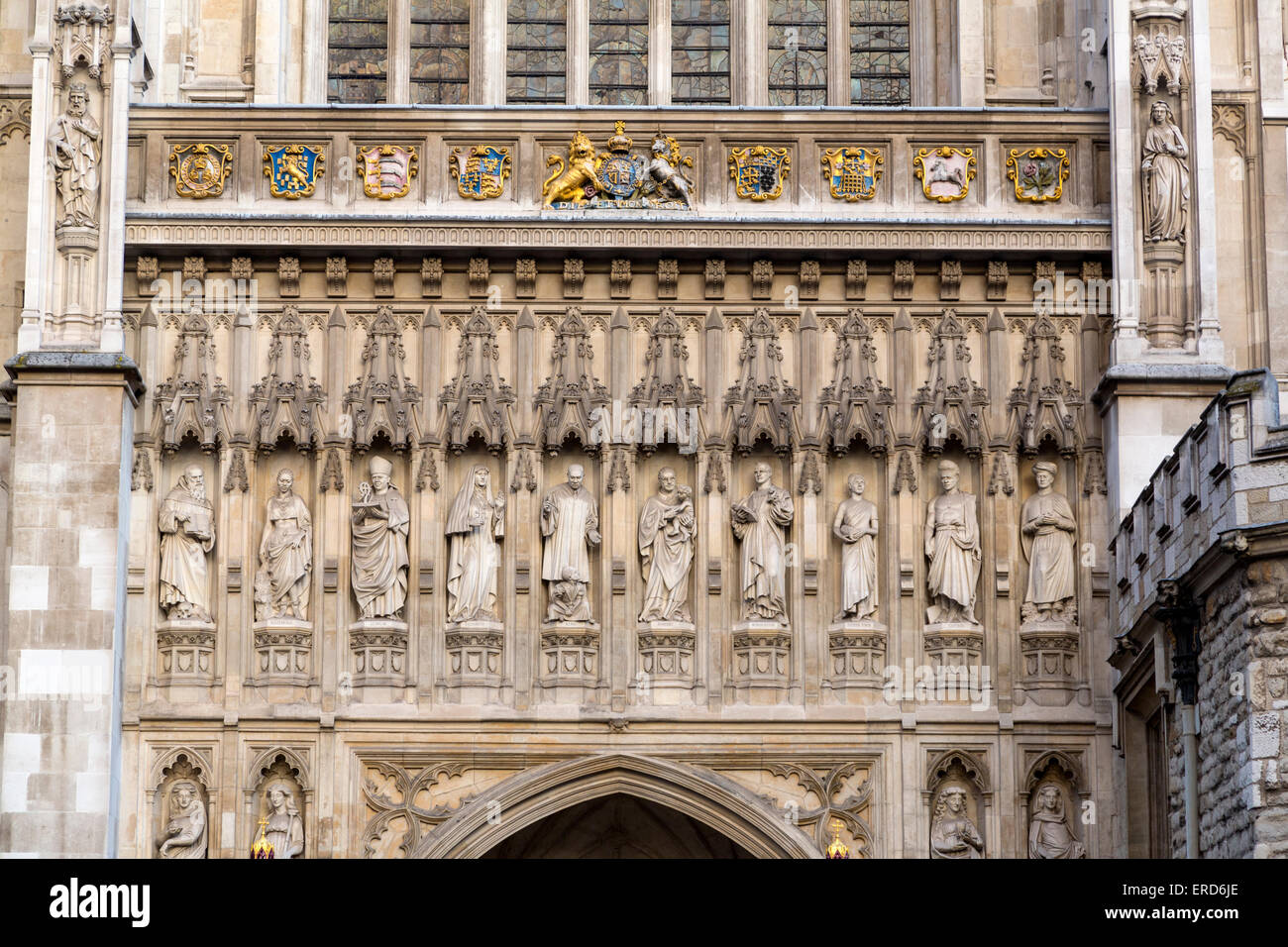London, England.  Westminster Abbey, Christian Martyr Statues Carved in Stone on Facade, added 1998. Stock Photo