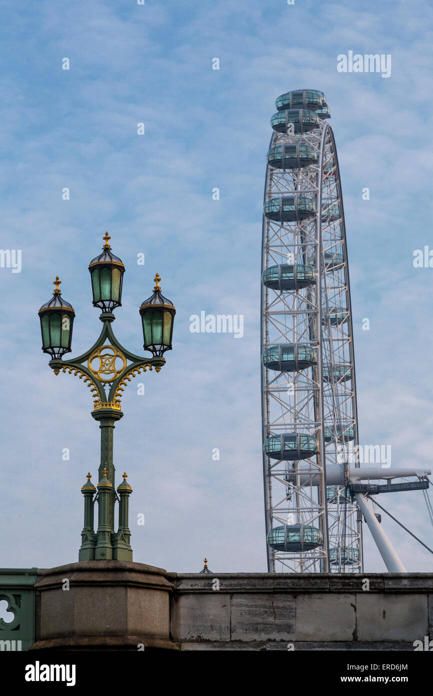 UK, England, London.  London Eye Ferris Wheel, Millennium Wheel, and Westminster Bridge Lamppost. Stock Photo