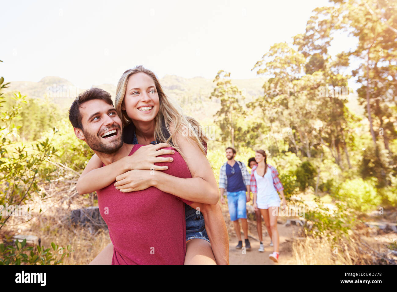 Group Of Friends On Walk Through Countryside Together Stock Photo - Alamy