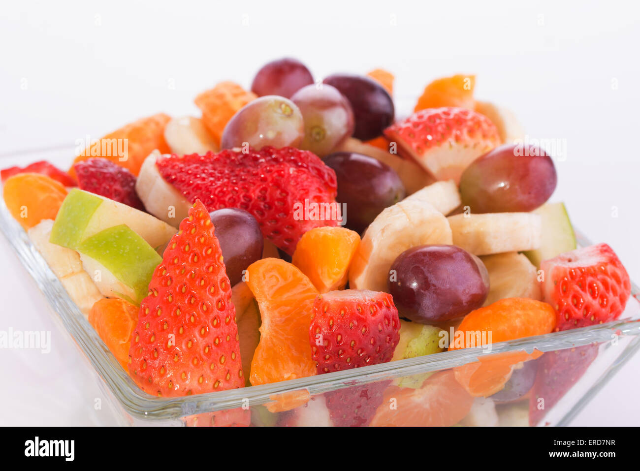 Closeup of a colorful fruit salad in a glass bowl Stock Photo - Alamy