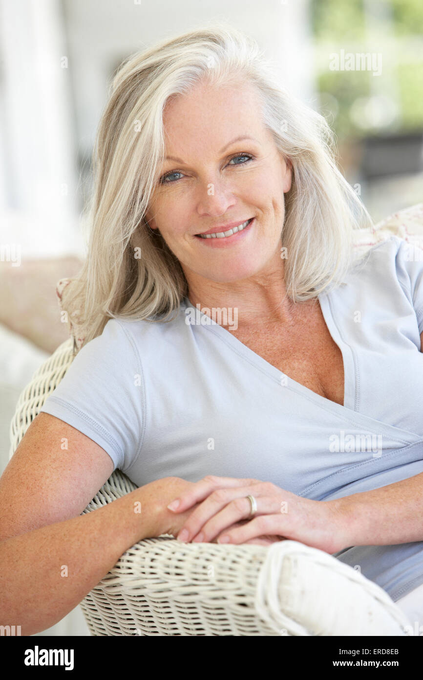 Portrait Of Senior Woman Relaxing In Chair Stock Photo - Alamy