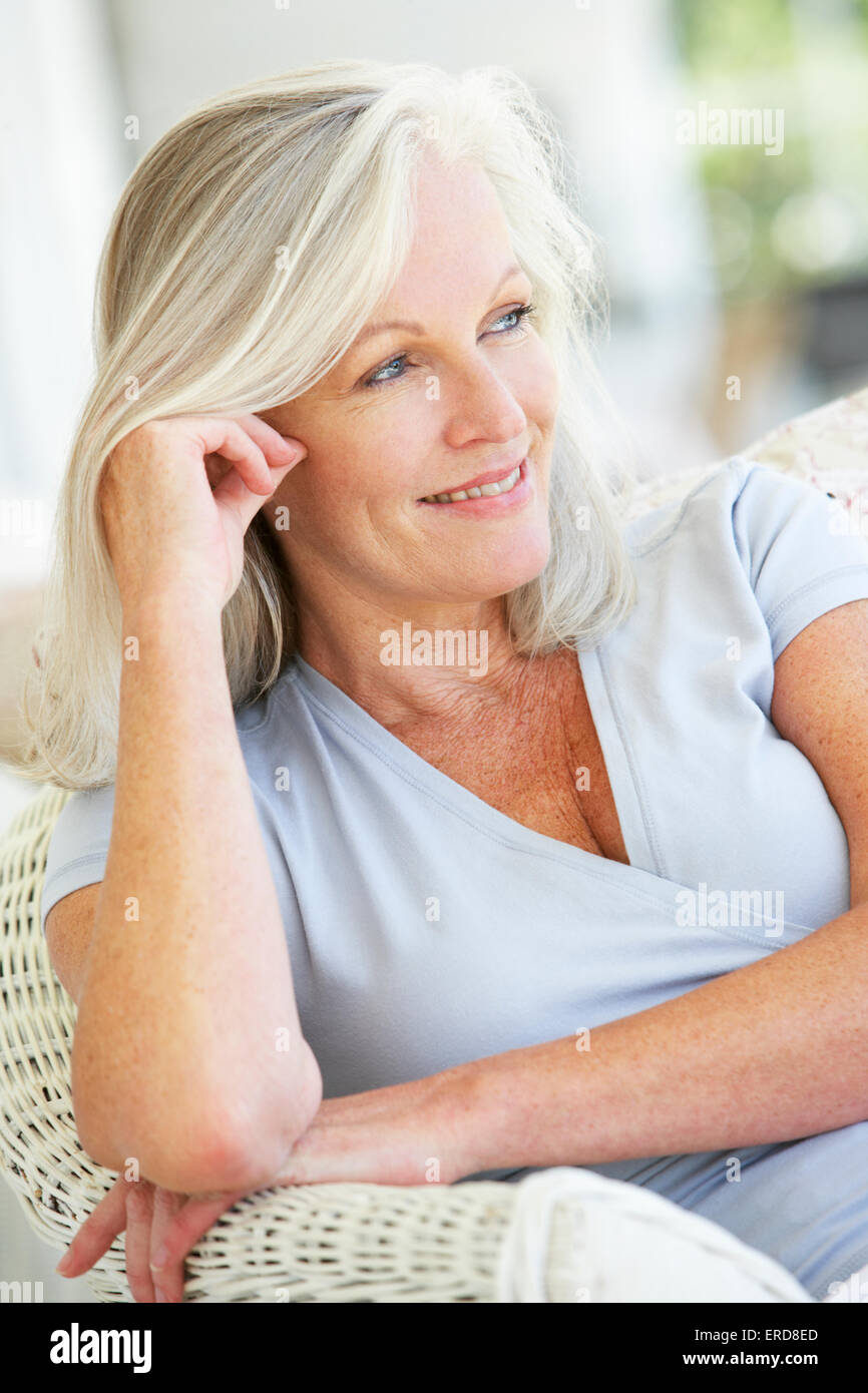 Portrait Of Senior Woman Relaxing In Chair Stock Photo - Alamy