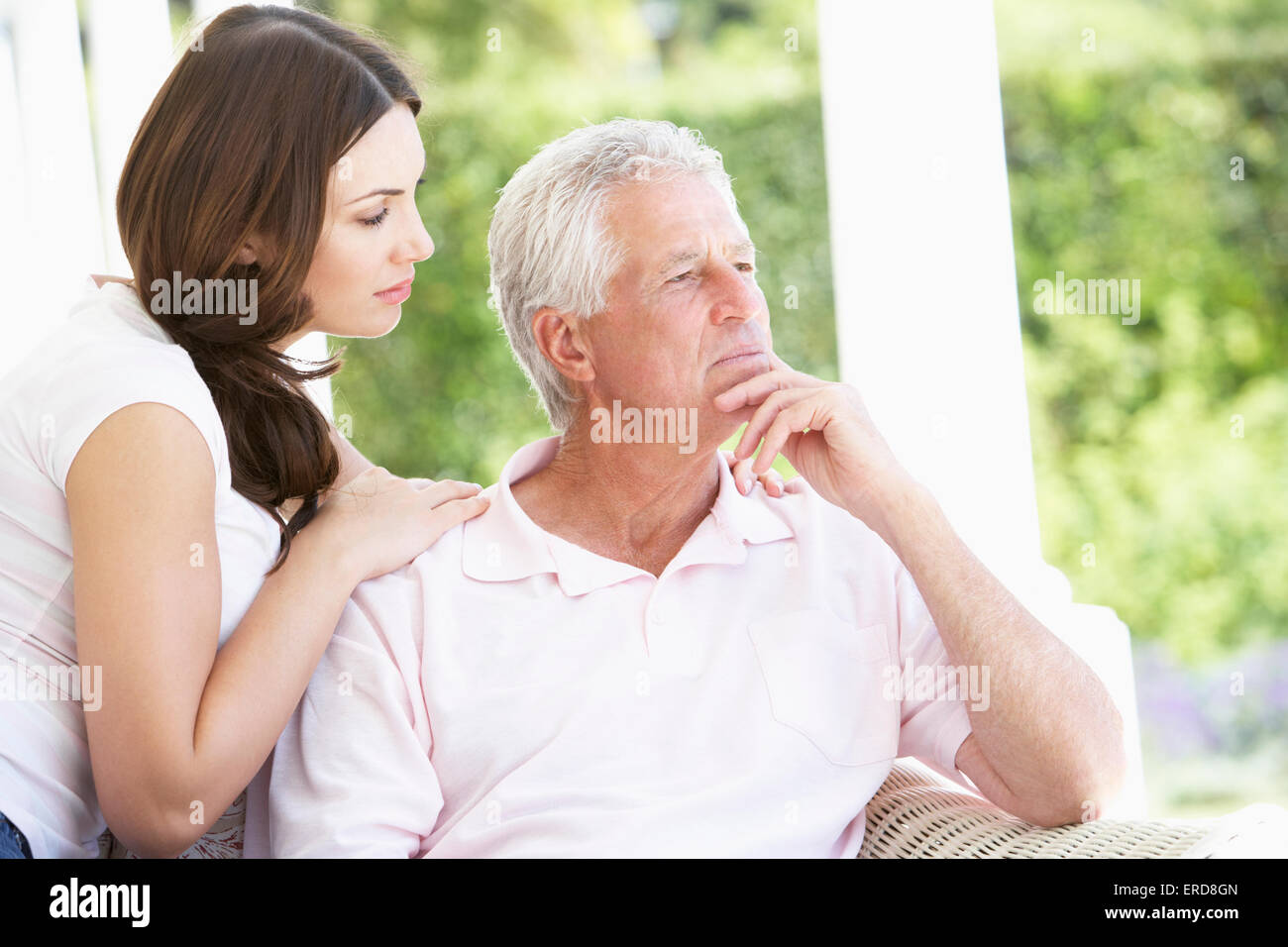 adult-daughter-comforting-worried-father-ERD8GN.jpg