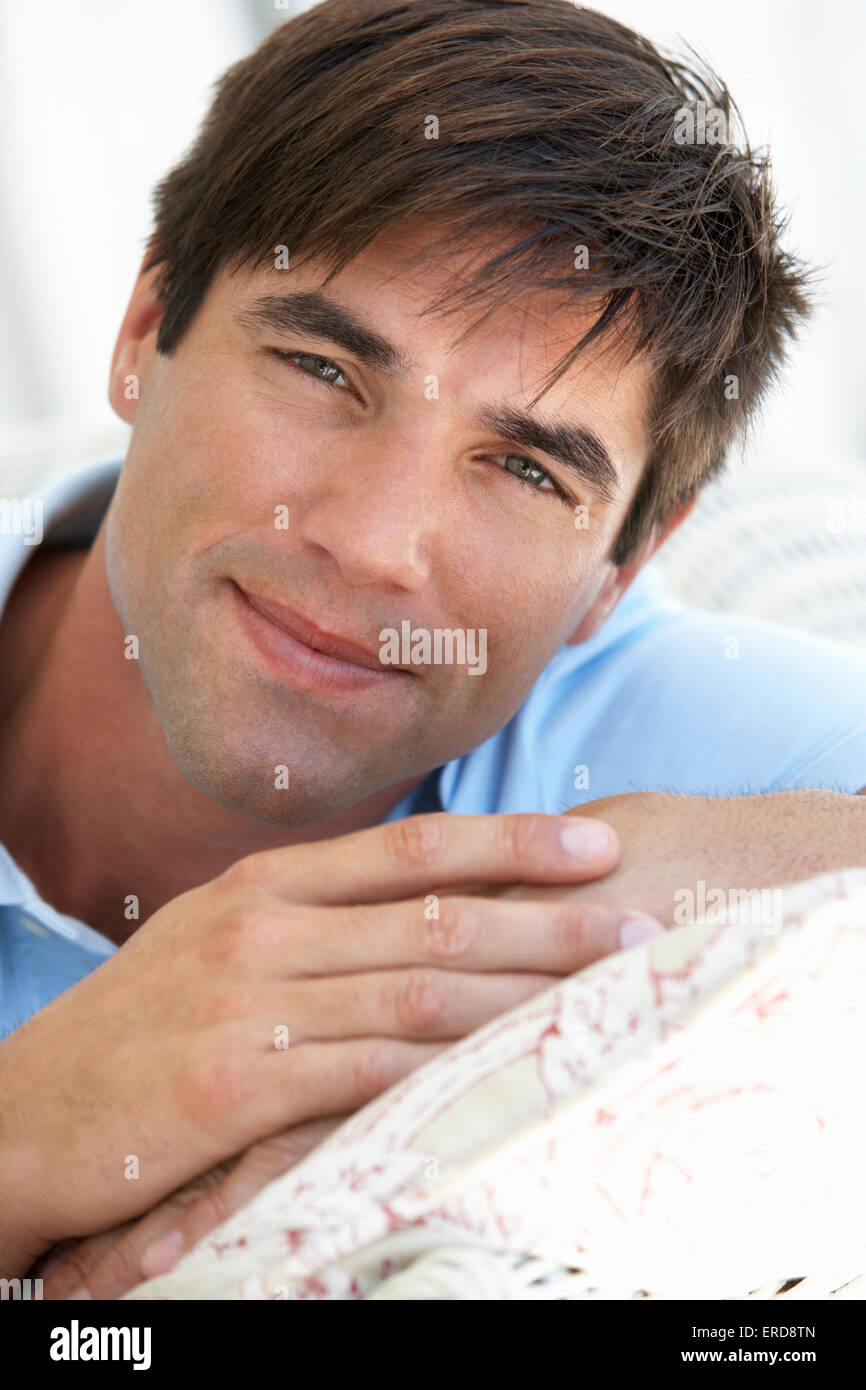 Portrait Of Man Relaxing In Chair Stock Photo