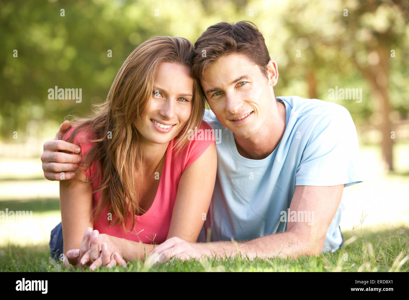 Couple Hugging in Park Stock Photo - Alamy