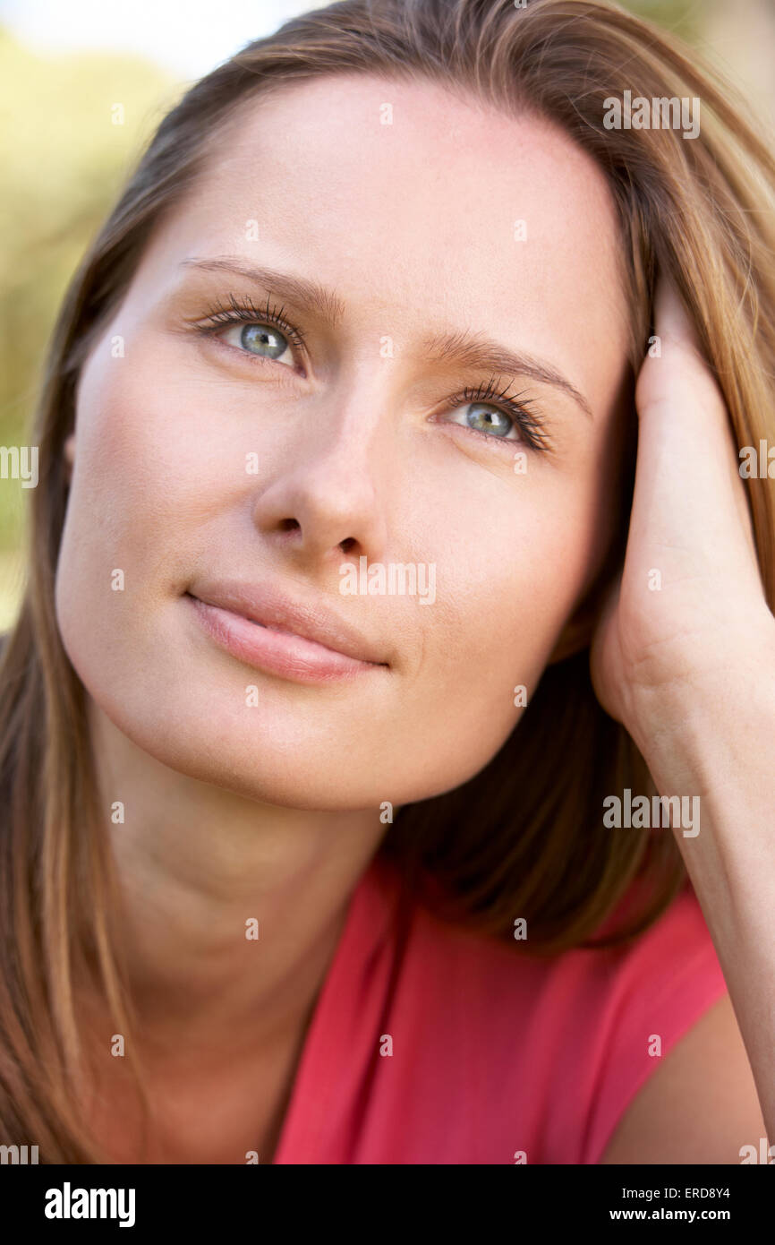 Portrait Of Attractive Young Woman Outdoors In Park Stock Photo - Alamy