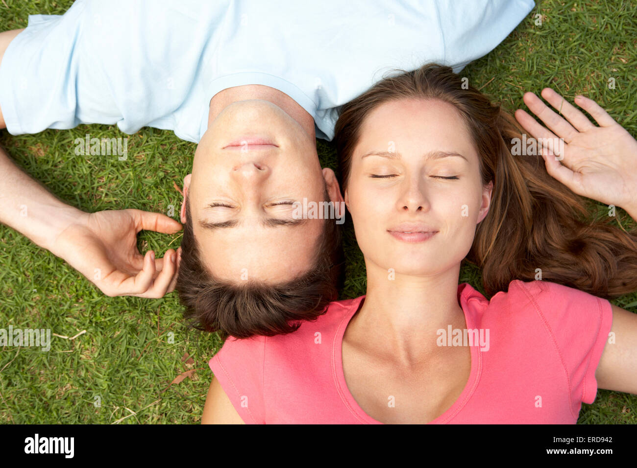 Overhead Of Couple With EyesClosed Stock Photo