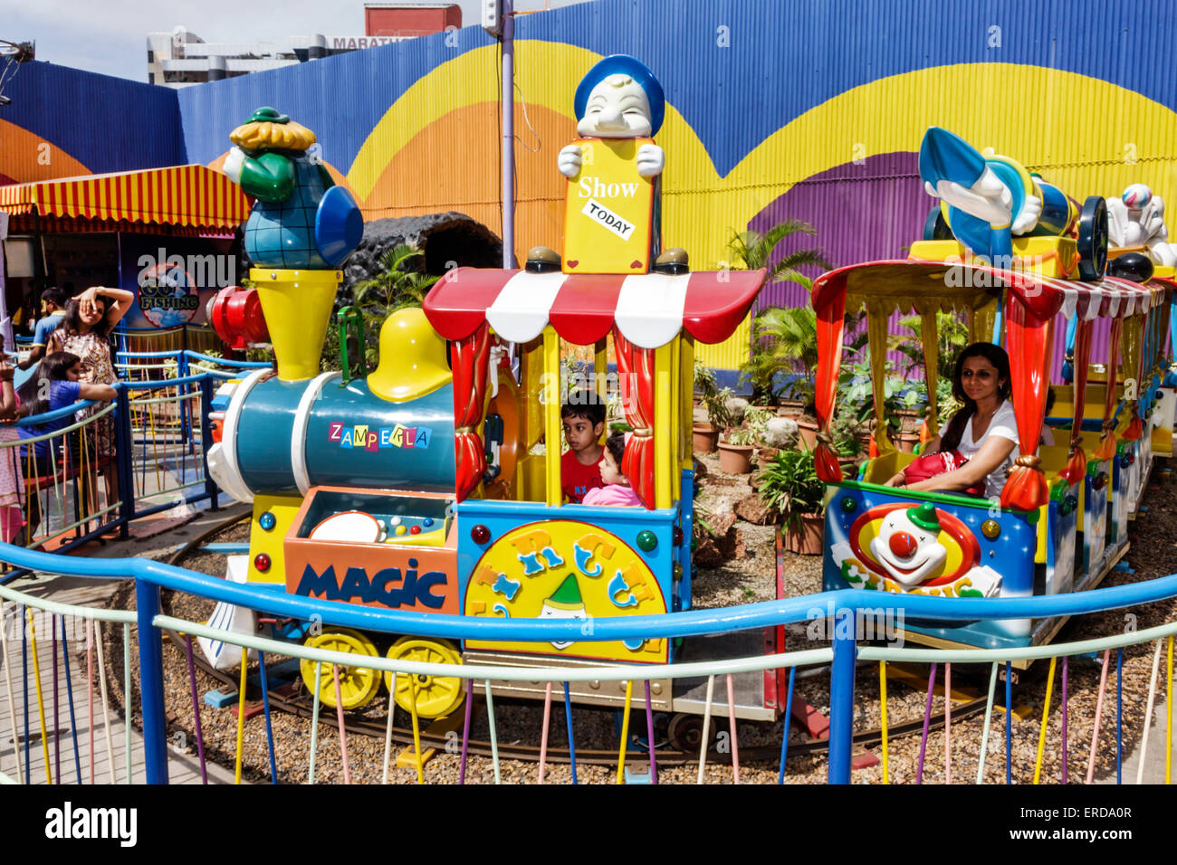 Mumbai India,Lower Parel,High Street Phoenix,mall,carnival ride,train,kiddie,male boy boys kids children riding,India150301135 Stock Photo